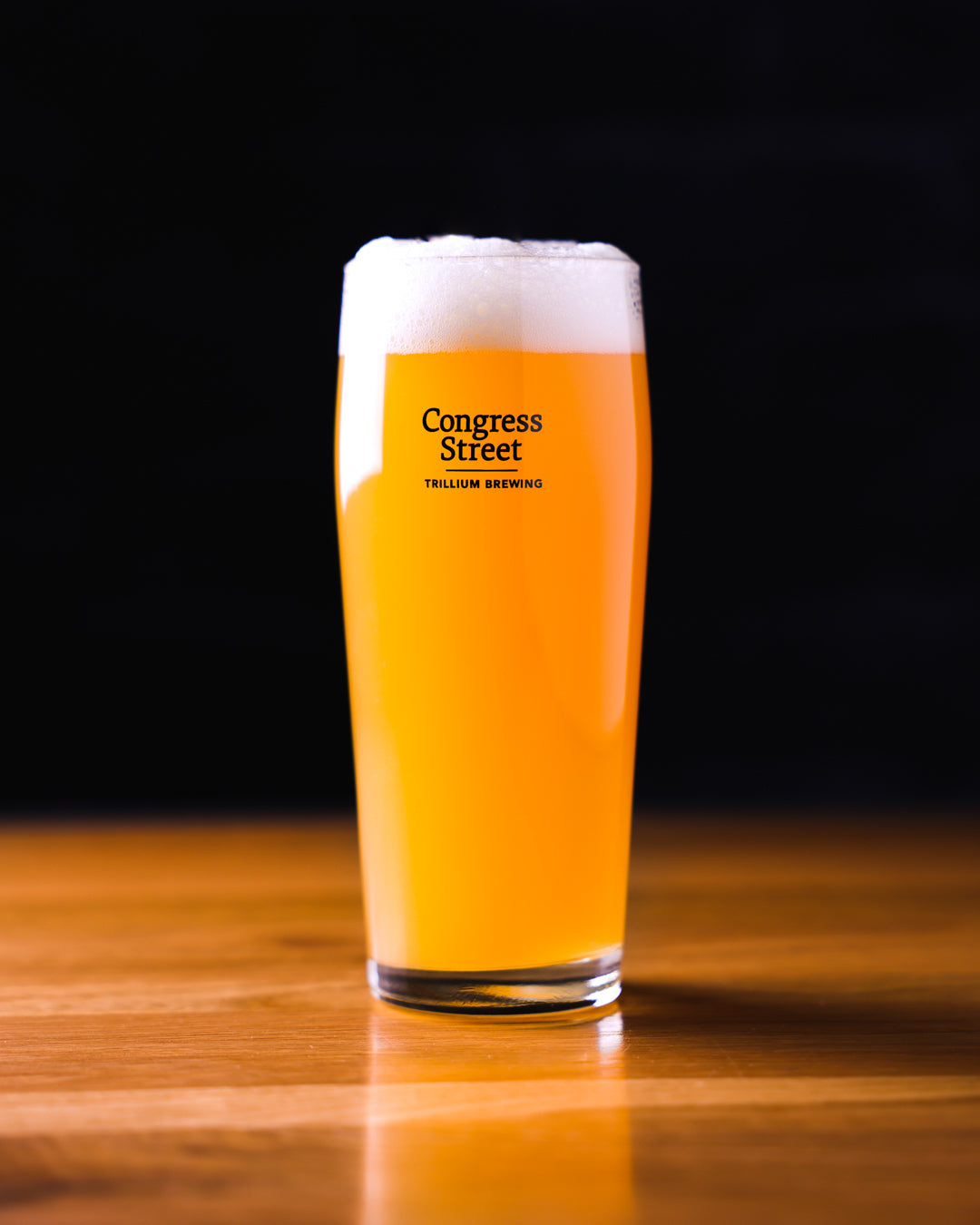 Trillium Congress Street Pub Glass full with beer